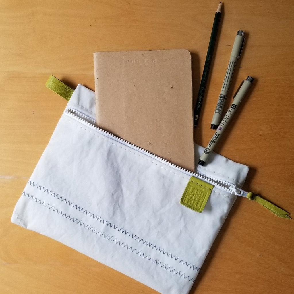 Keep like-items securely together within a larger bag or carry it alone. Zip pouch is handmade in Sausalito from upcycled sails.