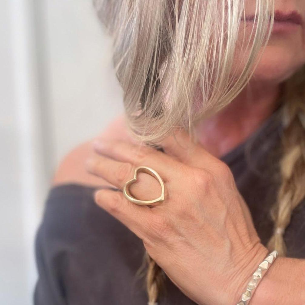 Open Heart Ring in bronze on model. At Poet and the Bench in Mill Valley