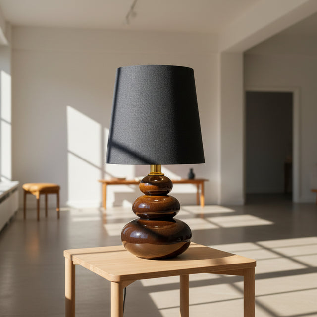Table lamp with a dark gray shade with 3 tiers of ceramic tortoise glazzed layers