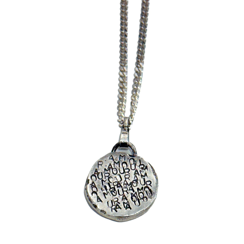 Express your love with this AMOUR-stamped silver medallion. Individually hand sand cast and stamped with multiple amours.