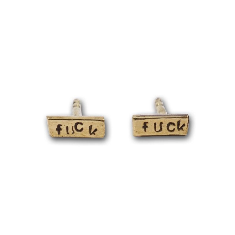 Unleash your inner rebel with these sweet stud earrings, featuring a subtle stamped message. Shown in 14K gold