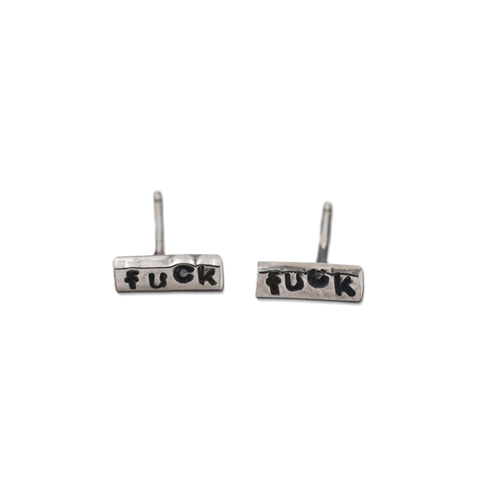 Unleash your inner rebel with these sweet stud earrings, featuring a subtle stamped message. Shown in sterling silver