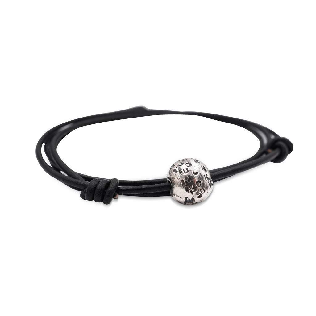 Self expression rules with this worry bead f-stamped silver ball on double leather cord bracelet.