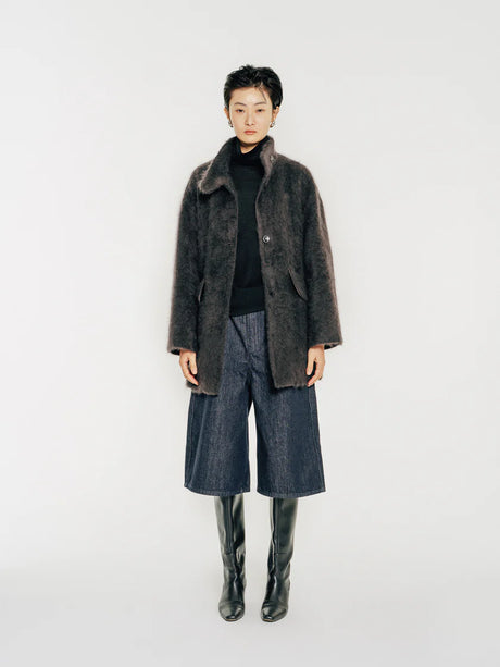 Model wearing Arden Brushed Wool and Cashmere Jacket, a single-breasted coat crafted from a luxurious blend of high-count Australian wool and cashmere. With a soft brushed effect, it holds an airy texture by Mute by JL New York