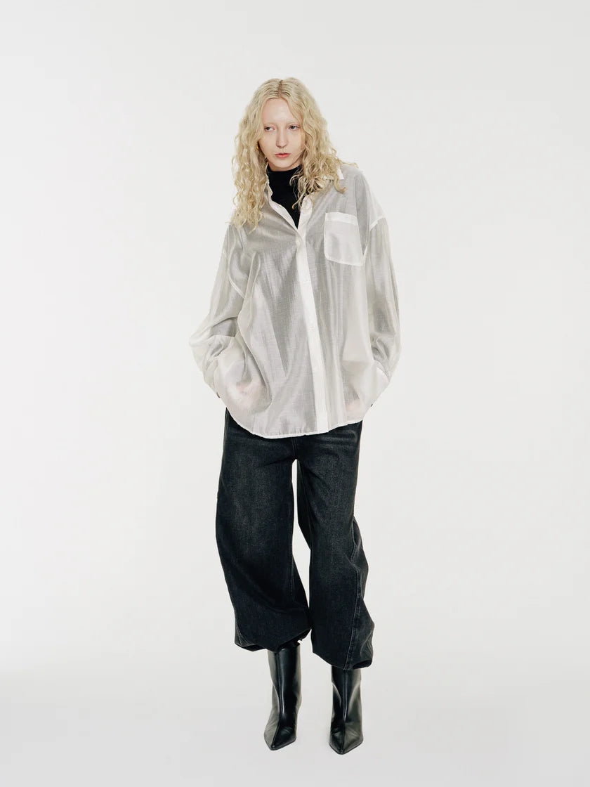 The Sol by Mute by JL is lightweight and fluid, an oversized shirt crafted from a semi-sheer Tencel fabric that features a silky touch and drapes with an effortless elegance. The soft translucency makes it a perfect layering piece