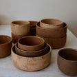 Stacking earthy glazed ceramic bowls of a simple shape with surface pattern created by hand with slip, mimicking stone in nature. Each piece is unique, as every stone in nature is unique. By Neko Co Neko, a trained architect and ceramicist.