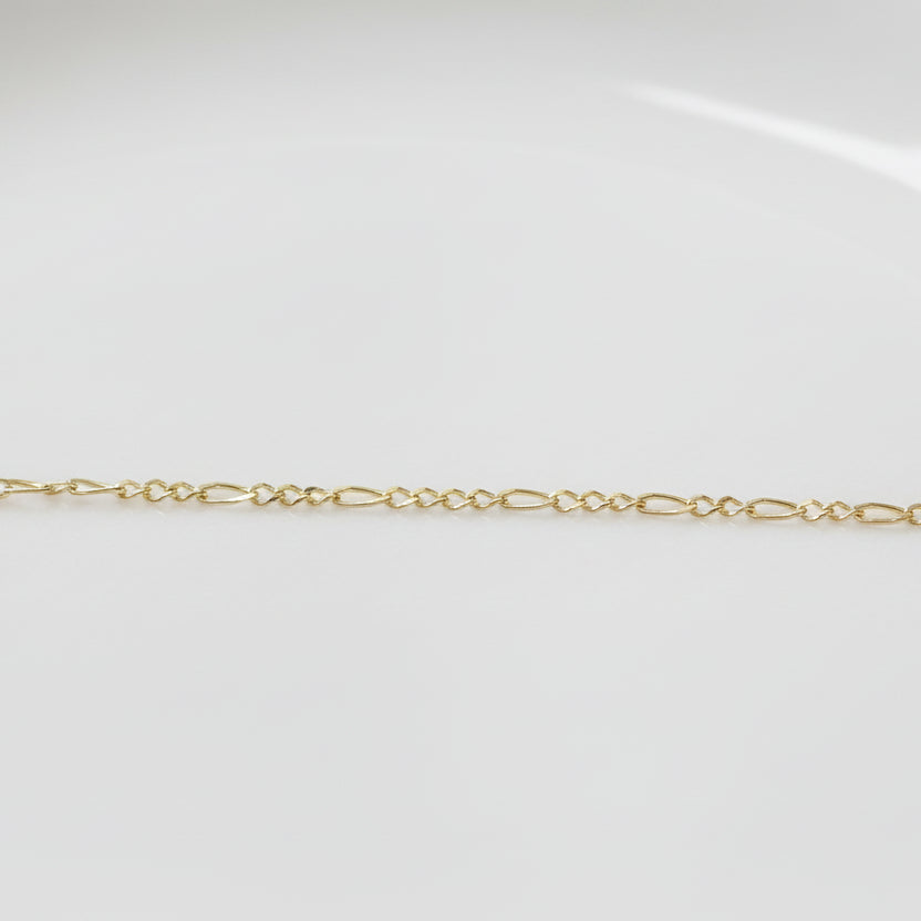 Permanent Jewelry Yellow Gold Figaro Classic Elongated and Round Chain Link Bracelet. Get Linked at Poet and/the Bench in Mill Valley. 