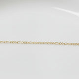 Permanent Jewelry Yellow Gold Figaro Classic Elongated and Round Chain Link Bracelet. Get Linked at Poet and/the Bench in Mill Valley. 