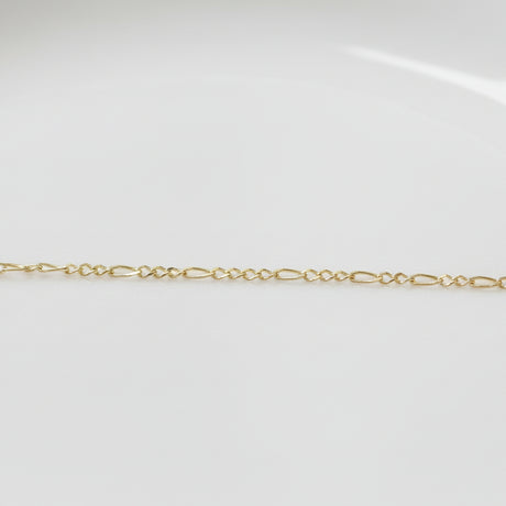 Permanent Jewelry Yellow Gold Figaro Classic Elongated and Round Chain Link Bracelet. Get Linked at Poet and/the Bench in Mill Valley. 