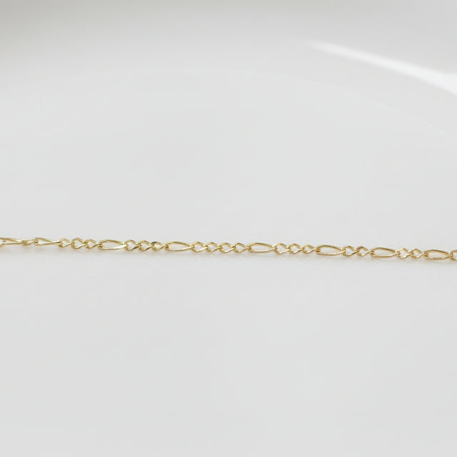 Permanent Jewelry Yellow Gold Figaro Classic Elongated and Round Chain Link Bracelet. Get Linked at Poet and/the Bench in Mill Valley. 
