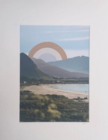 Collage landscape with mountains, ocean, and a cut paper sun in the sky.