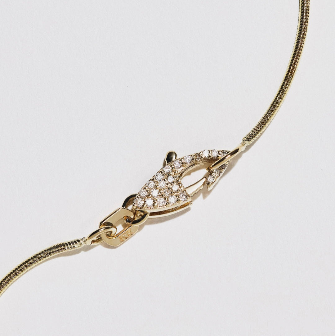 Snake chain with pave diamond clasp. We love this style for its clean lines and quiet luxury. 