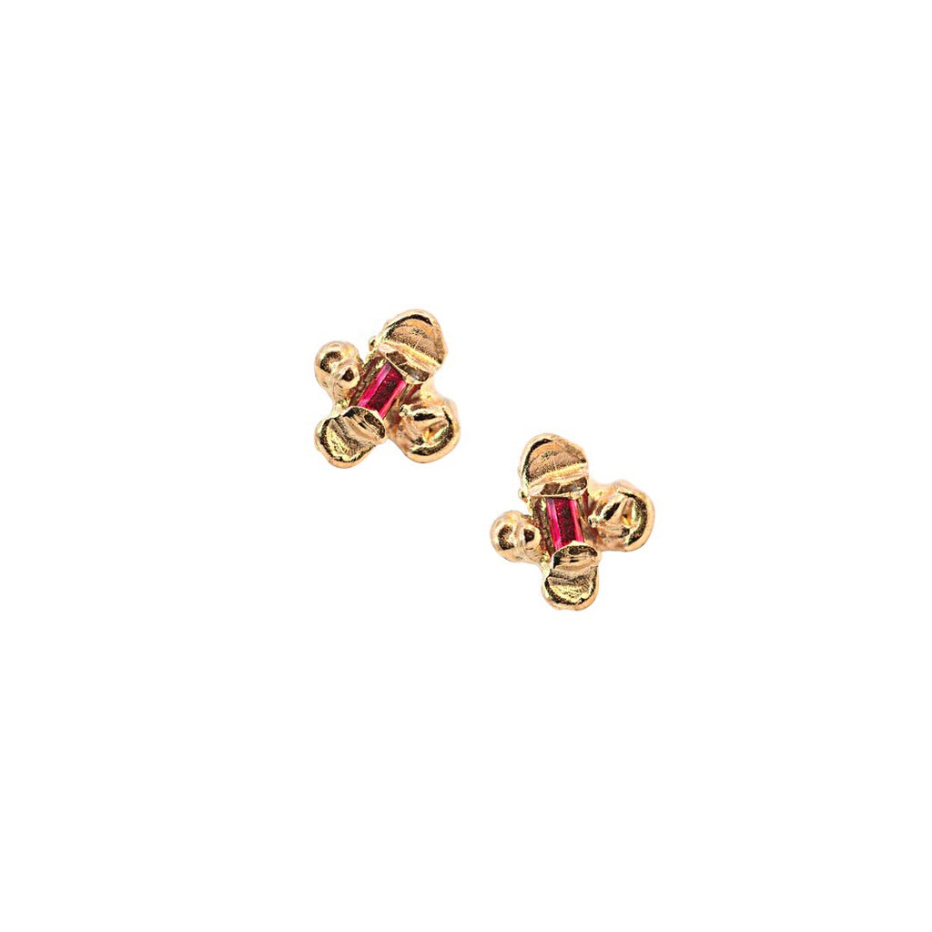 Idun is a four petal 14k yellow gold flower stud earring with ethically mined Rubies from Thailand.