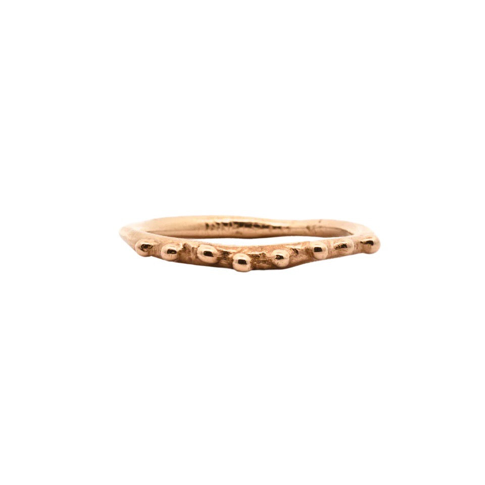 14k gold skinny hammered ring has a wavy texture with dotted detail and melty edges by Siri Hansdotter