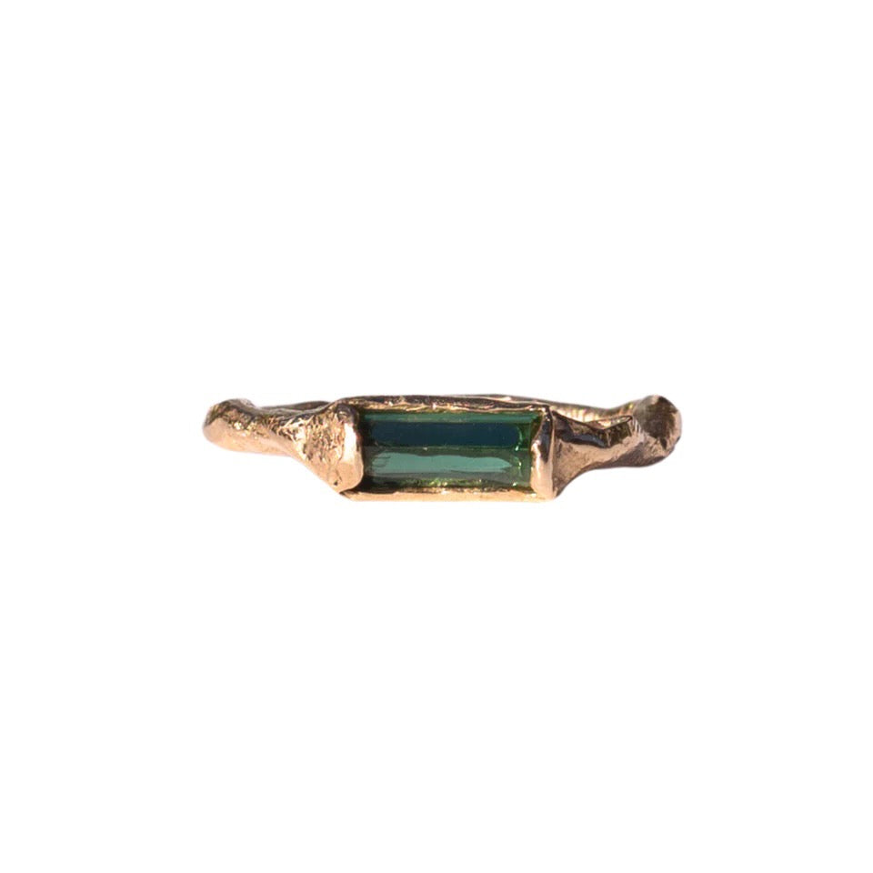 Rich green tourmaline stacking ring has an organic shaped band. Made for stacking or worn individually–designed to be part of a collection of layering rings by spreading them across fingers on both hands. Front view
