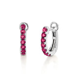 White Gold Hinged huggie hoop earrings feature 7 rhodolite colored gemstones in each hoop. 