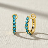 London Blue gemstones in yellow gold hinged huggie hoop earrings