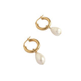 The Amy are a pretty pearl hoop earring pair with their unexpectedly sculptural, freshwater cultured pearls. 