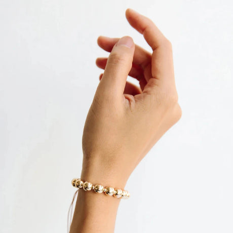 The Moon Sun Bracelet has 15 gold ball beads that reflect the 15 days in each of the 24 cycles of the lunar year for a very bright, golden future.