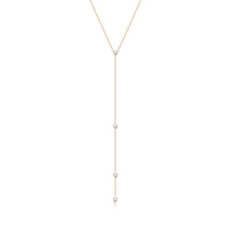 A gorgeous Y or lariat-style necklace in 14K yellow gold, rose gold or white gold. 4 round white diamonds are suspended along the lustrous gold chain. Shown in Rose Gold. 