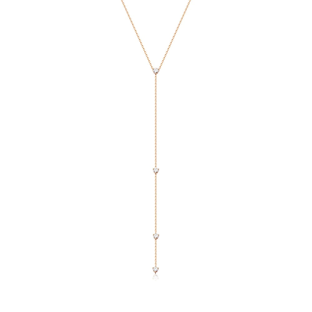 A gorgeous Y or lariat-style necklace in 14K yellow gold, rose gold or white gold. 4 round white diamonds are suspended along the lustrous gold chain. Shown in Rose Gold. 