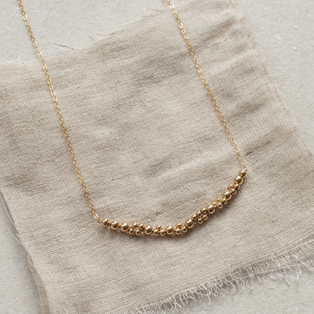 Columba adds a bold touch of elegance on its own or to layer up with other necklaces. An alternative design to popular bar necklaces, it features a segment of Abacus Row's signature bead work captured on a simple chain.