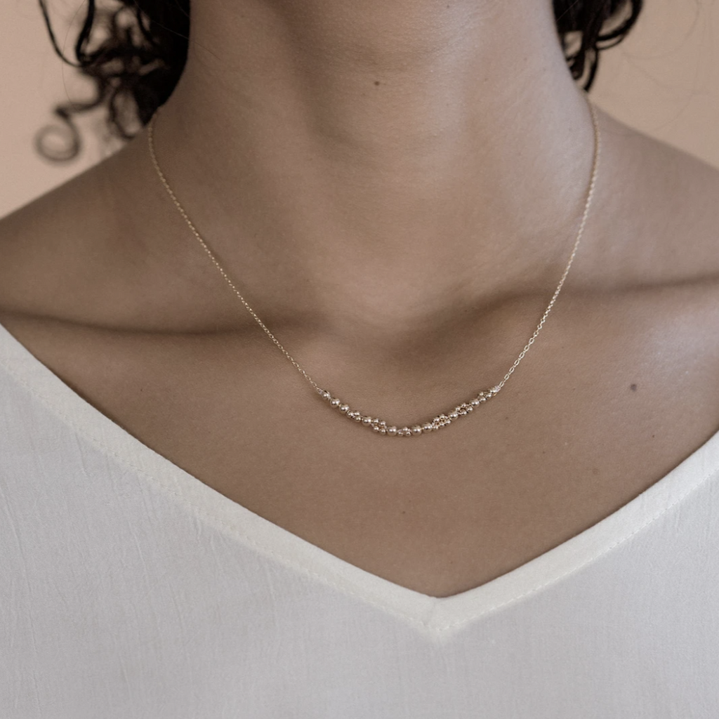 Columba adds a bold touch of elegance on its own or to layer up with other necklaces. An alternative design to popular bar necklaces, it features a segment of Abacus Row's signature bead work captured on a simple chain.