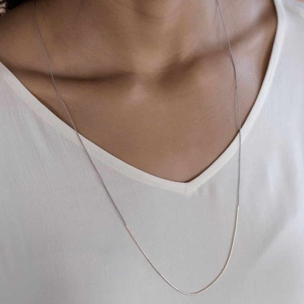The Dorado is an elegant silk cord necklace for the ultra-minimalist. The single adjustable length strand adds a subtle touch of elegance, and for a bolder look layer up with multiple strands or with other necklaces. 