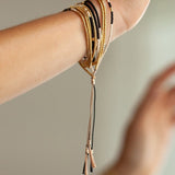 The Gobi is a convertible necklace to wrap bracelet made with 24k gold-plated Japanese glass beads and subtly accented with 14k gold-filled rounds.