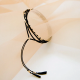 This piece is intended to be worn as a necklace or bracelet, and each piece is uniquely patterned so that no two are identical.