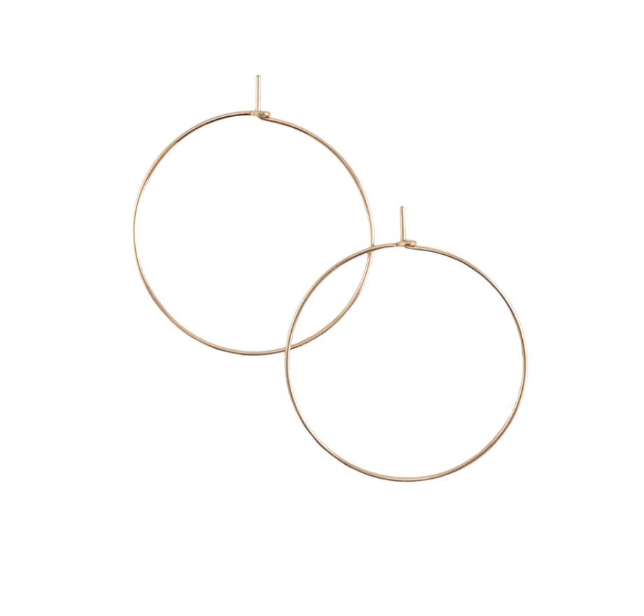 Effortless unadorned earrings for everyday wear. Our tiny hand-hammered hoops are lightweight yet sturdy, making them great for continuous wear and pairing with other earrings.