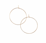 Effortless unadorned earrings for everyday wear. Our tiny hand-hammered hoops are lightweight yet sturdy, making them great for continuous wear and pairing with other earrings.