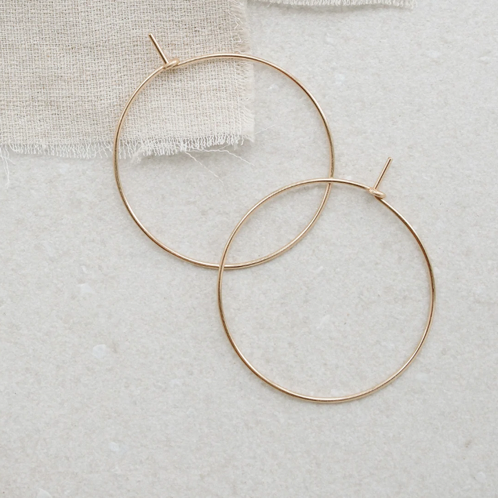 With Abacus Row's Simple Hoops, designer Christine Trac goes super minimalist. Each earring hoop is hand hammered from 14k gold-filled wire. 