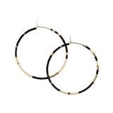 With Abacus Row's Tanami Hoops, designer Christina Trac plays with fixed and open pattern designs. Each earring hoop is hand hammered from 14k gold-filled wire and beaded by hand. These large hoops are whisper light for everyday adornment. Polar