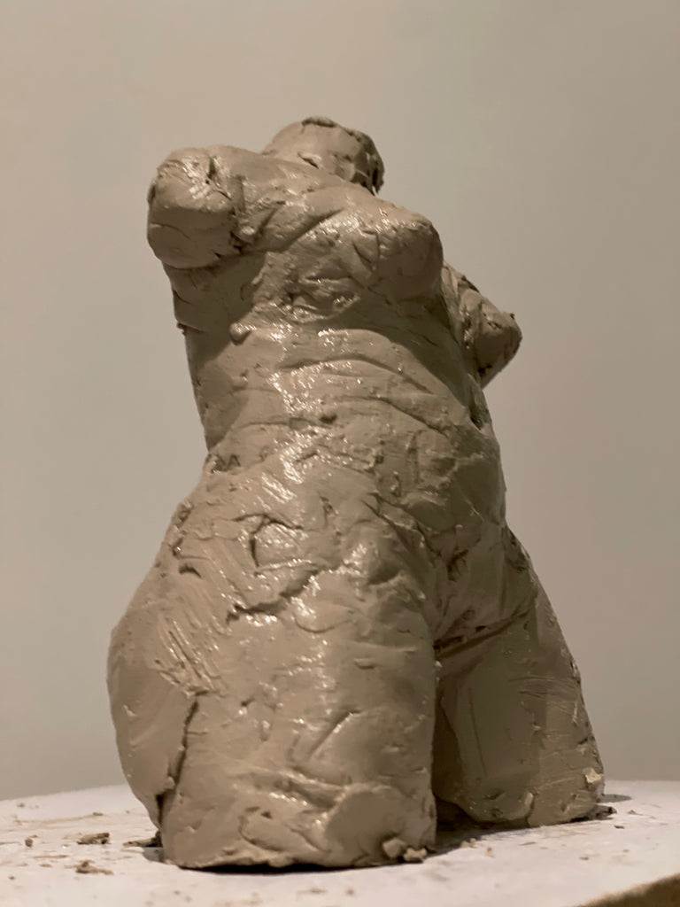 Pinch pottery clay human figure torso sculptures in progress by artist Denise Carletta. Side view