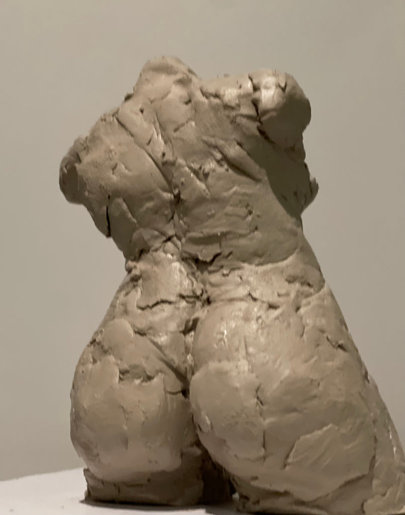 Pinch pottery clay human figure torso sculptures in progress by artist Denise Carletta. Back view