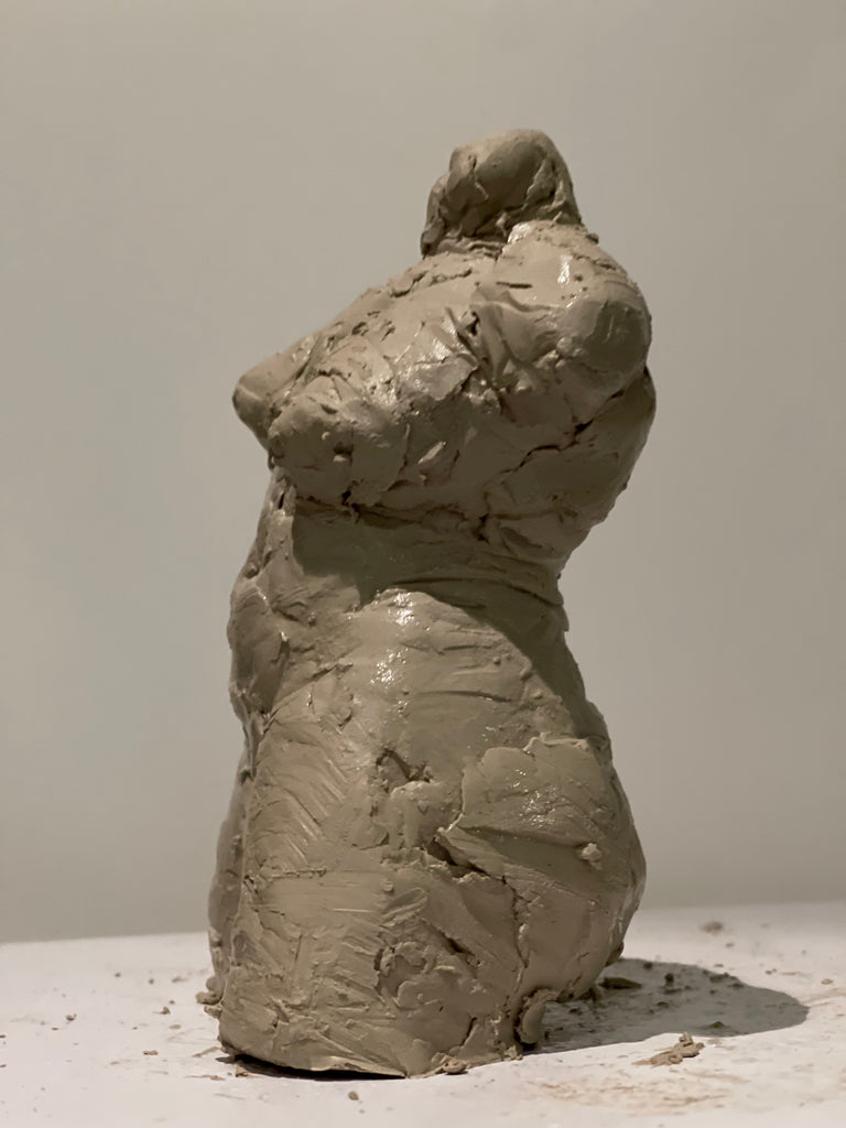 Pinch pottery clay human figure torso sculptures in progress by artist Denise Carletta. Side view