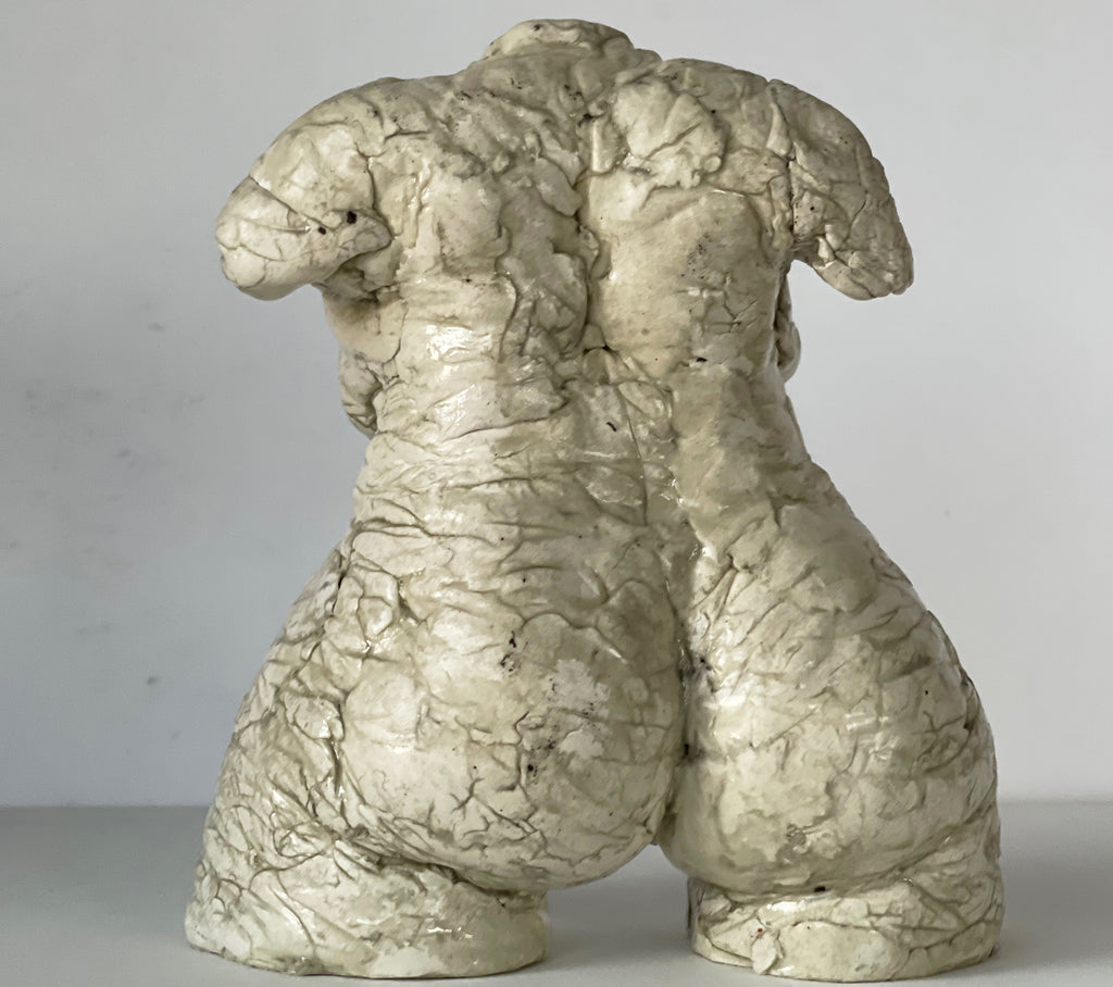 By artist Denise Carletta, this is a slightly larger Female Torso sculpture, in white and beautifully formed for a side table, book shelf, on top of a stack of artist books on your coffee table. Back view