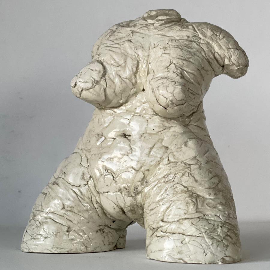 By artist Denise Carletta, this is a slightly larger Female Torso sculpture, in white and beautifully formed for a side table, book shelf, on top of a stack of artist books on your coffee table. Front view