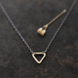 With three sides, and the number three thought to be a magical number, Esther Metals designed this everyday triangle necklace to be your lucky charm. 