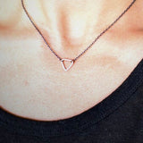 The shape of the triangle has been used as a symbol since the beginning of time. With three sides, and the number three thought to be a magical number, Esther Metals designed this everyday triangle necklace to be your lucky charm. 