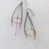 These dramatic earrings hold the Earth within the atmosphere or your inner thoughts among the cosmos. We love how the gold details pop in contrast to the oxidized silver. This version is extra long. 
