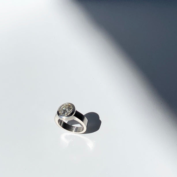 Mill Valley goldsmith Jeffrey Levin custom designed platinum modern solitaire engagement ring.