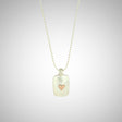 Jeffrey reimagined the classic dog tag into a modern canvas, both refined and a bit edgy. He loves mixing metals and embellished this sterling silver dog tag with a contrasting 14K rose gold tiny heart charm.