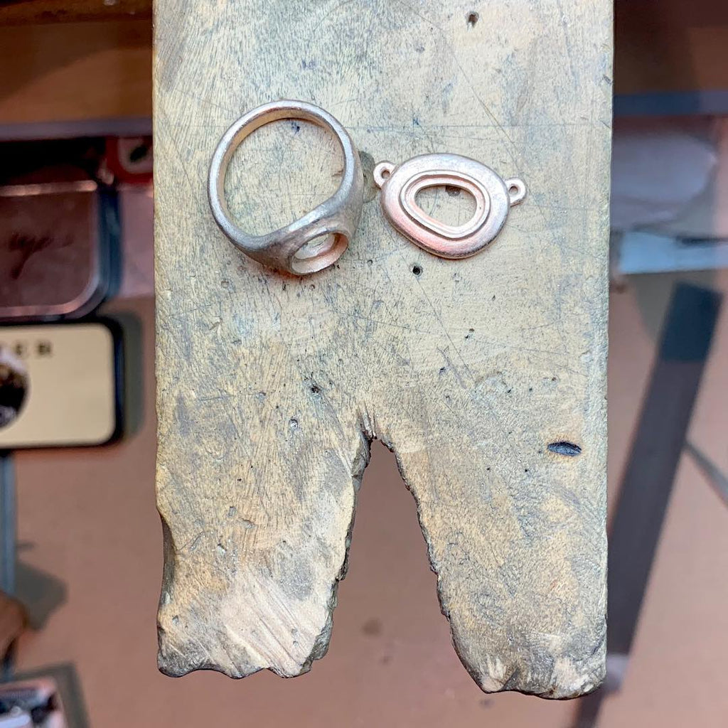Process of castings getting ready for setting for bespoke pendants and rings with tourmaline and opals. By Jeffrey Levin.