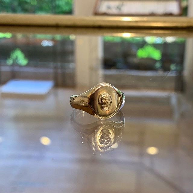 Jeffrey reimagines the classic Signet Ring, reworking it with feminine lines and using it as a canvas for other pretty and handsome things, like this contrasting skull adornment in 14K rose gold. 