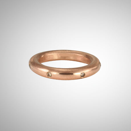 Stunning layered or alone–goes with everything, thick round stacking rings. Mixed metals available in sterling silver; 14k yellow, white or rose gold; or platinum. Take your stack to another level, embellished with diamonds and gems. Rose gold with cognac diamonds shown. 