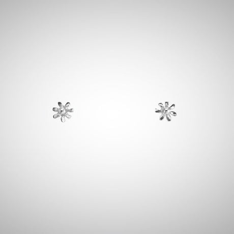 A delicate flower but mighty in spirit. These are his most tiny, carved by hand in wax before being cast in precious metals. Perfect for layering as multiples. Sterling Silver