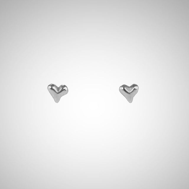 Jeffrey has been carving hearts from the beginning. These are his most tiny, carved by hand in wax before being cast in precious metals. Perfect for layering as multiples. Shown in sterling silver.