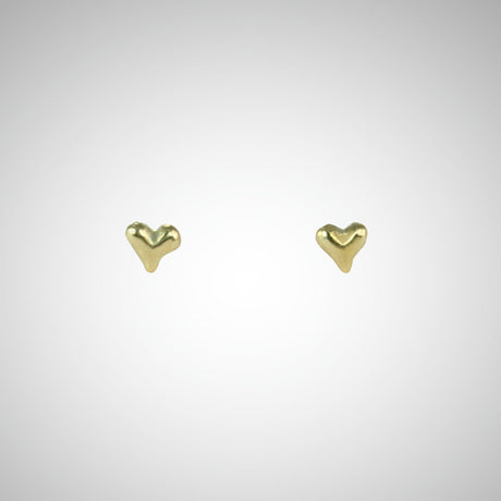 Jeffrey has been carving hearts from the beginning. These are his most tiny, carved by hand in wax before being cast in precious metals. Perfect for layering as multiples. Shown in yellow gold